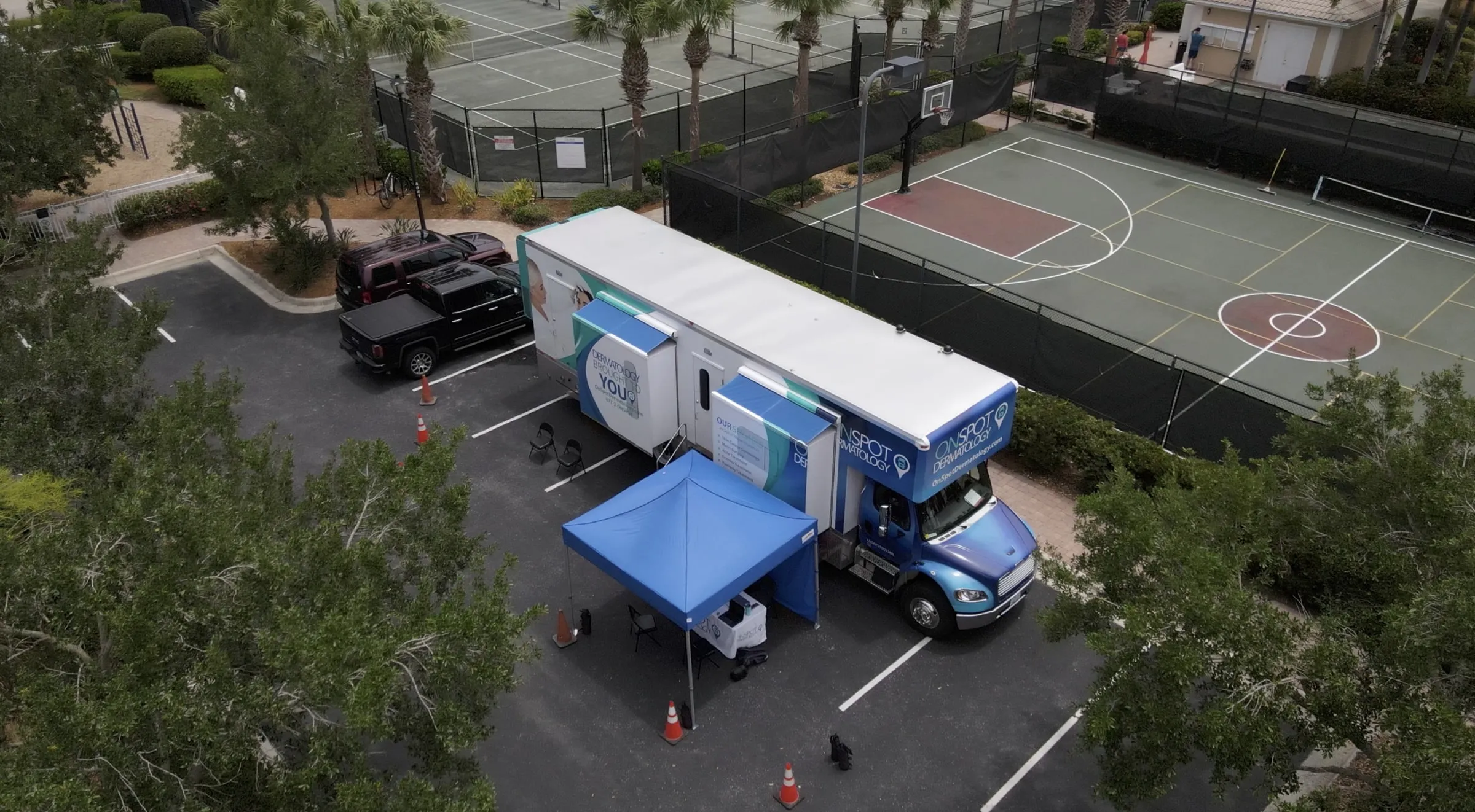 Aerial view of the OnSpot Dermatology Derma Drive mobile unit set up at a Florida community