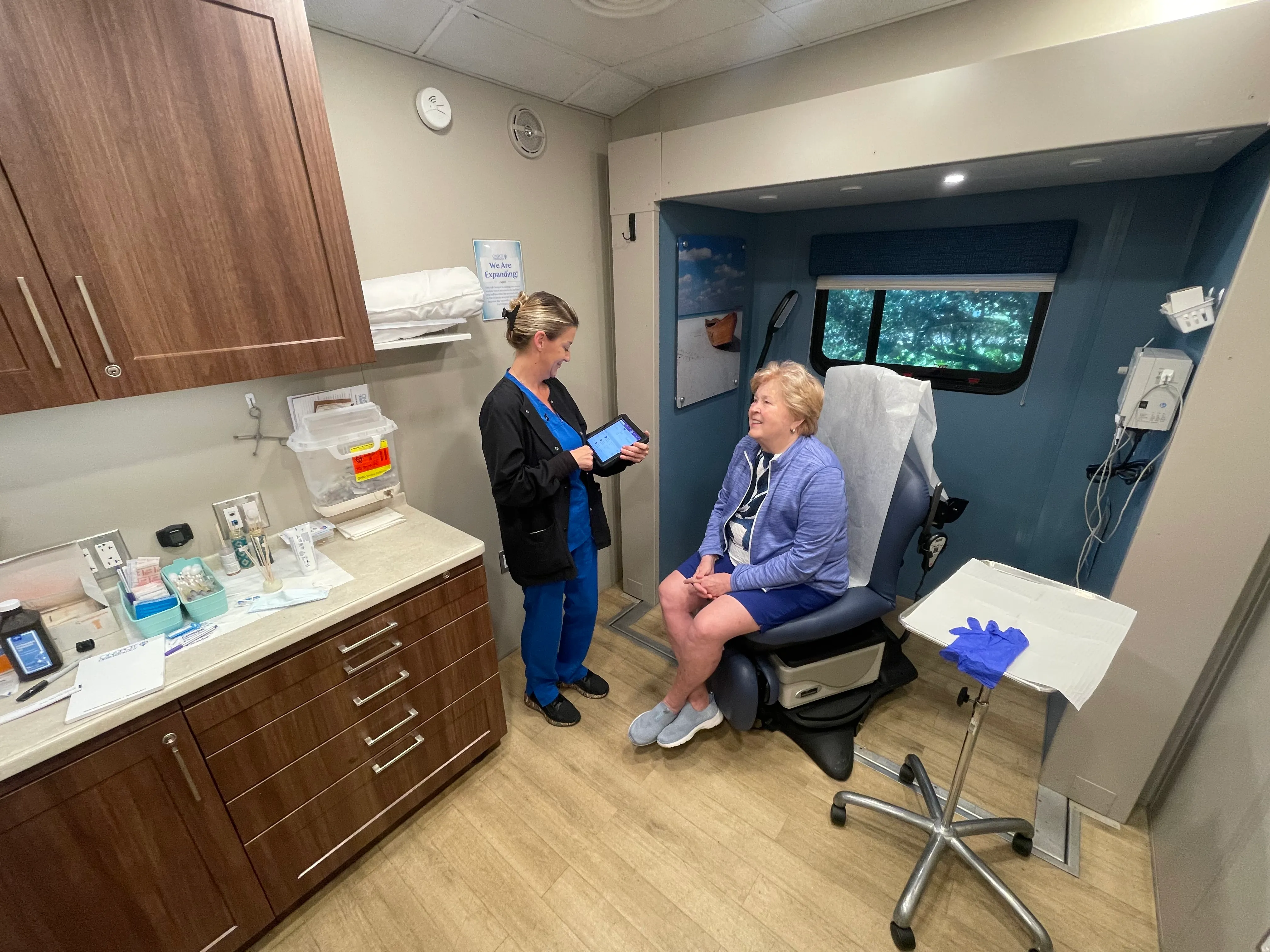 Patient consultation inside OnSpot mobile dermatology unit